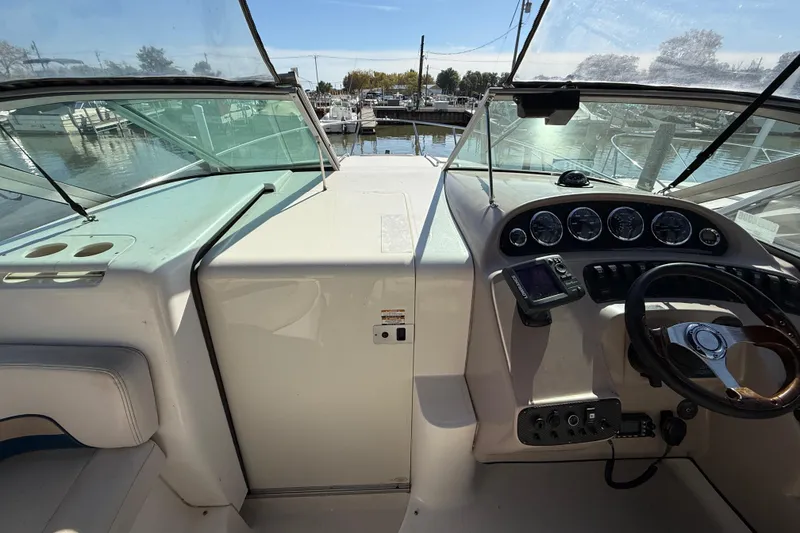 Slide: The Image of 1999 Chaparral Signature 300 boat cockpit with steering wheel and instrument panel. - 21