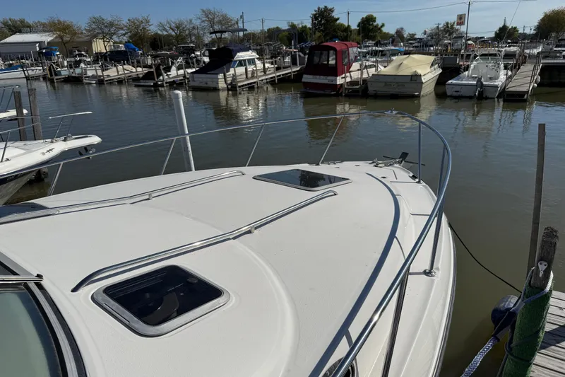 Slide: The Image of Chaparral Signature 300 boat docked at marina, 1999 model, sunny day. - 4