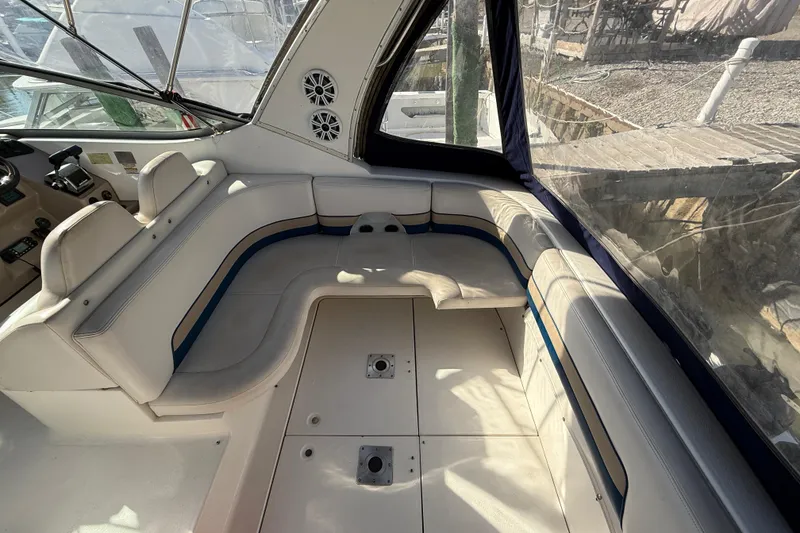 Slide: The Image of 1999 Chaparral Signature 300 boat interior with white seating and control panel. - 8
