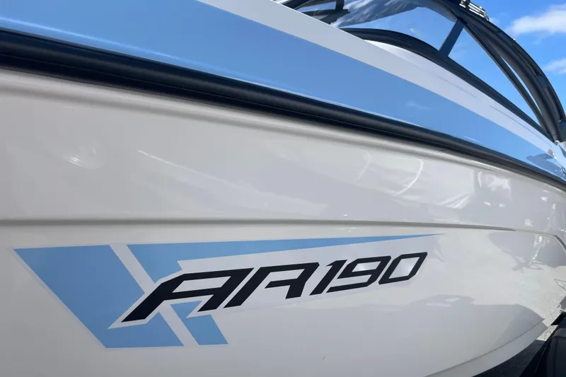 Slide: The Image of 2026 Yamaha Boats AR190, sleek white and blue design, close-up view. - 1