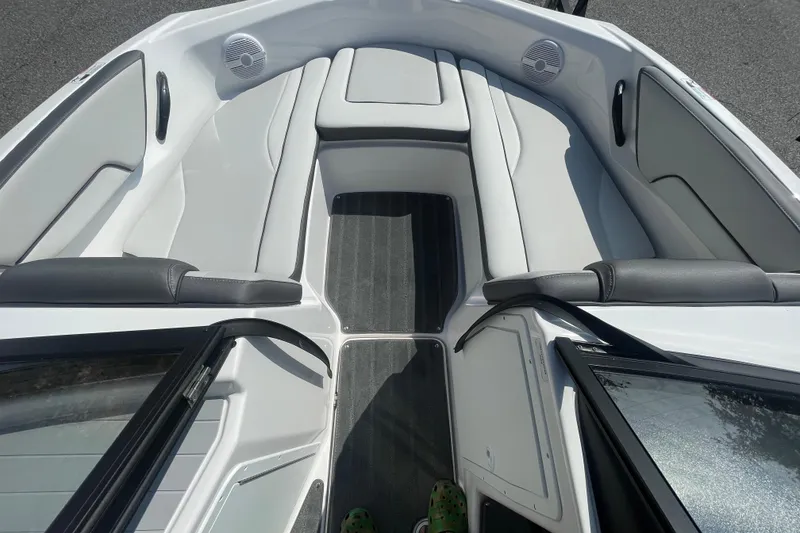 Slide: The Image of 2026 Yamaha Boats AR190 interior with white seating and speakers. - 11