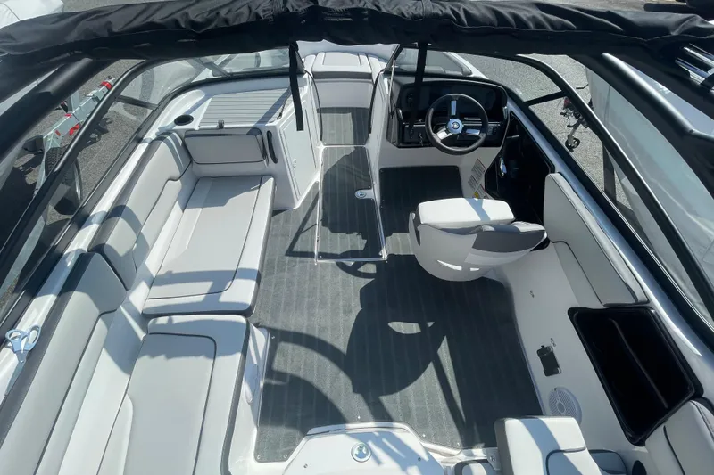 Slide: The Image of 2026 Yamaha Boats AR190 interior with seating and steering wheel, showcasing modern design. - 14