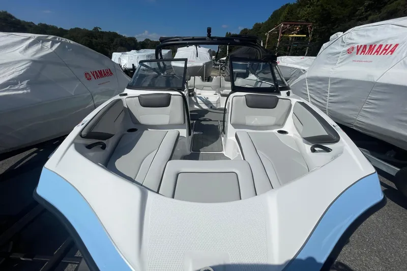 Slide: The Image of 2026 Yamaha AR190 boat with sleek interior design, parked outdoors. - 4