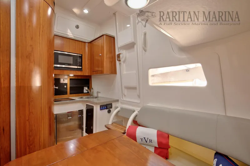 Slide: The Image of Luxurious interior of 2016 Regulator 41 boat with kitchenette and seating area. - 10