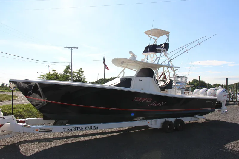 Slide: The Image of 2016 Regulator 41 boat on trailer at Raritan Marina, sunny day. - 2