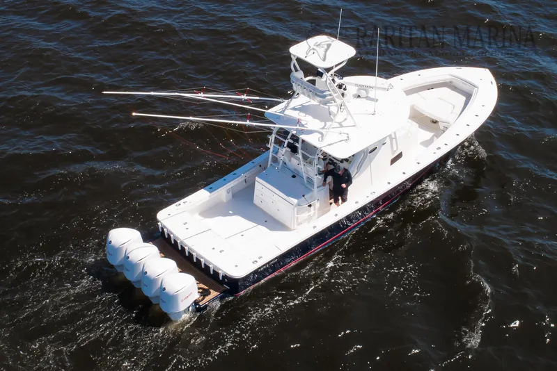 Slide: The Image of 2016 Regulator 41 boat cruising on open water with multiple outboard engines. - 3