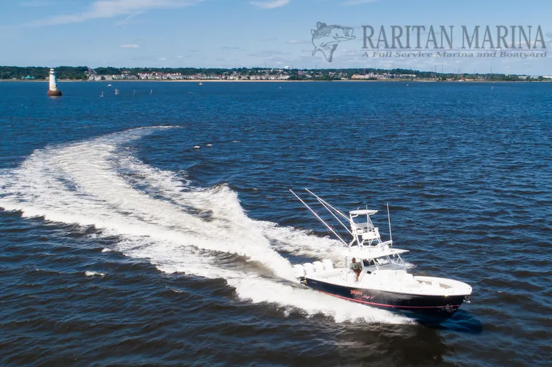 Slide: The Image of 2016 Regulator 41 boat cruising on open water near Raritan Marina. - 5