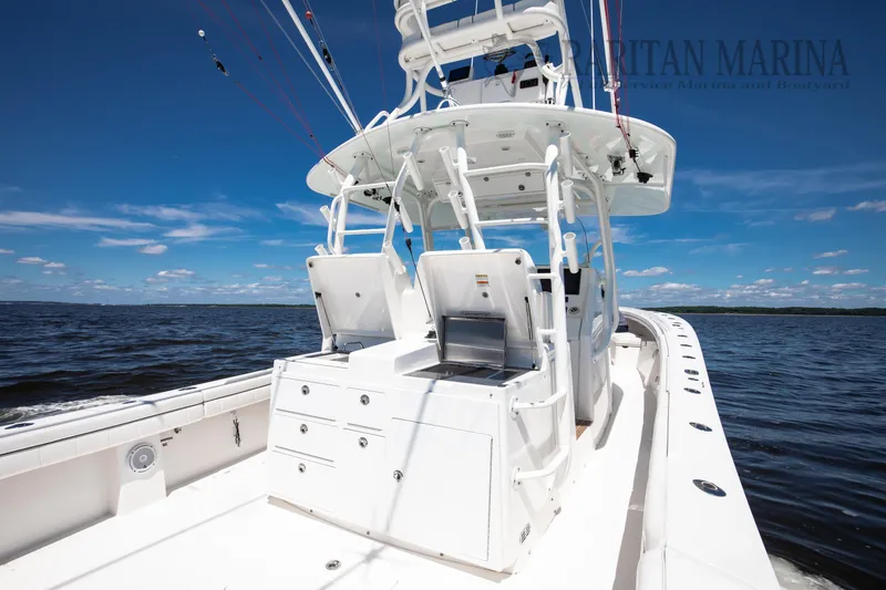 Slide: The Image of 2016 Regulator 41 boat on open water, featuring sleek design and fishing equipment. - 8