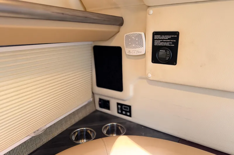 Slide: The Image of 2020 Cobalt R35 interior with beige upholstery, control panel, and cup holders. - 10