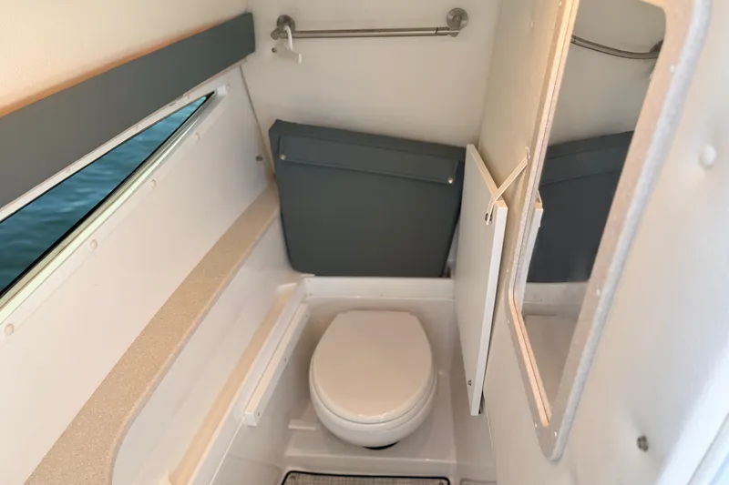 Slide: The Image of Compact bathroom in 2020 Cobalt R35 boat with toilet and mirror. - 13