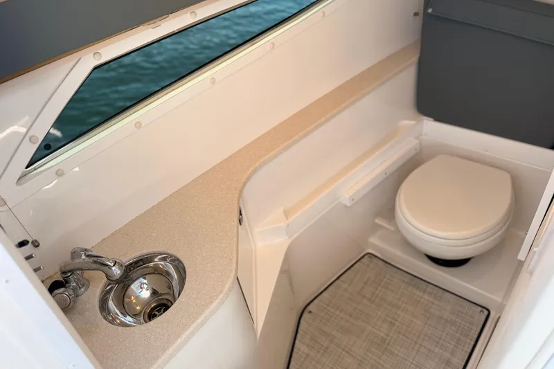Slide: The Image of 2020 Cobalt R35 boat interior with sink and toilet, featuring modern design. - 14