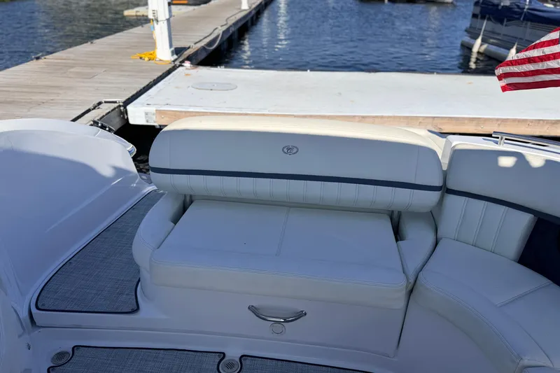 Slide: The Image of 2020 Cobalt R35 boat interior with white seating at a dock. - 20