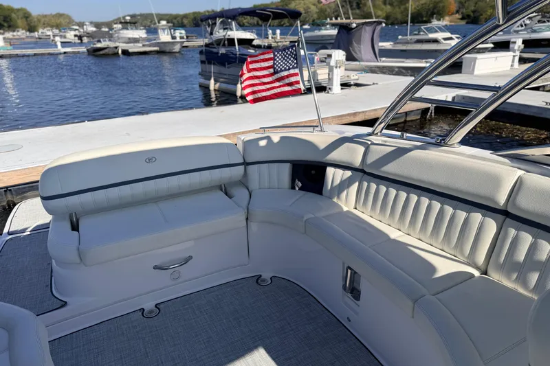Slide: The Image of Luxurious seating on a 2020 Cobalt R35 boat docked at a marina. - 22