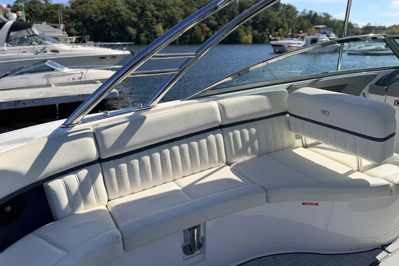 Slide: The Image of Luxurious seating on a 2020 Cobalt R35 boat, docked by a scenic waterfront. - 23