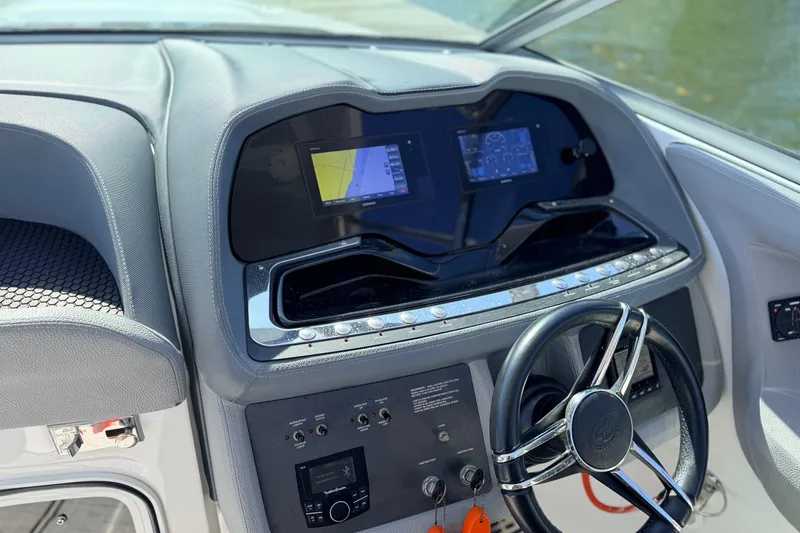 Slide: The Image of Cockpit of 2020 Cobalt R35 boat with modern navigation displays and steering wheel. - 25