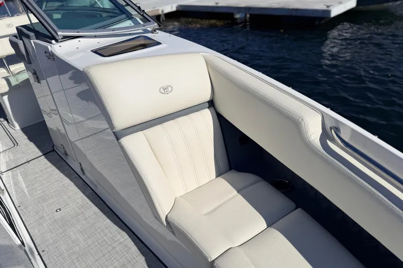 Slide: The Image of Luxurious seating on a 2020 Cobalt R35 boat, docked by the water. - 29
