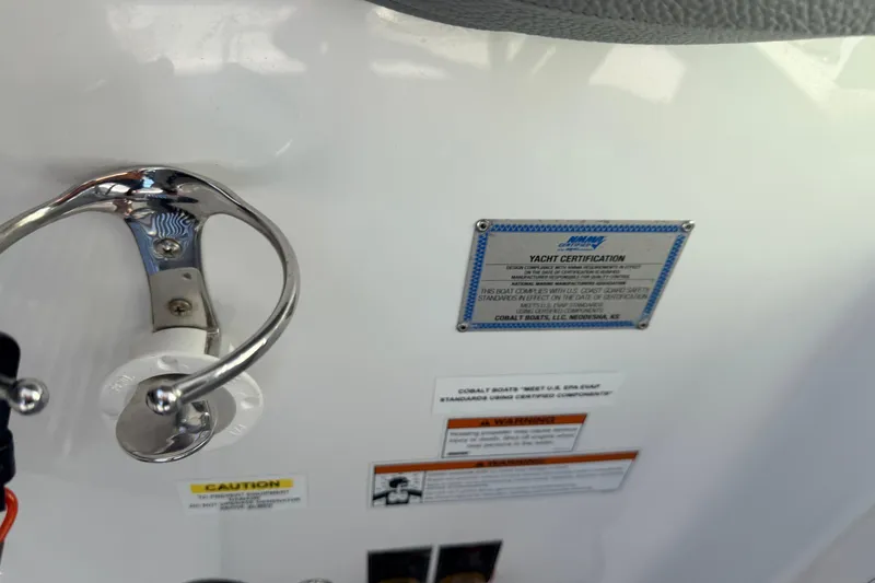 Slide: The Image of 2020 Cobalt R35 yacht certification plaque and safety warnings on white surface. - 33