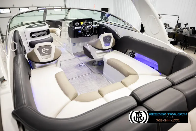 Slide: The Image of 2022 Crownline 265 SS boat interior with luxurious seating and modern dashboard. - 12