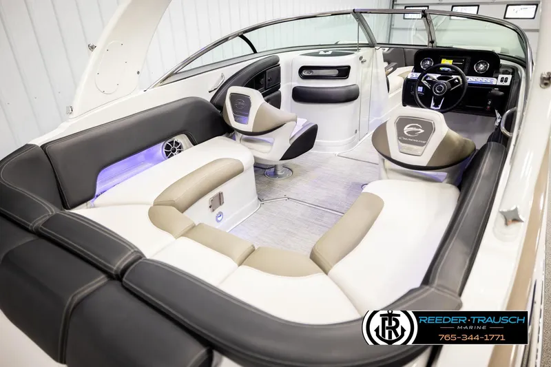 Slide: The Image of 2022 Crownline 265 SS boat interior with luxurious seating and modern dashboard. - 13
