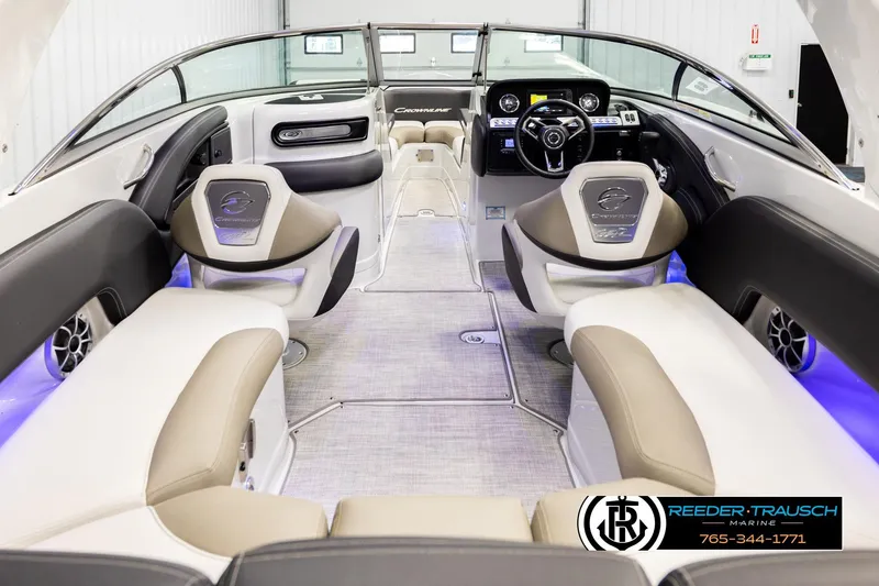 Slide: The Image of 2022 Crownline 265 SS boat interior with modern seating and dashboard. - 14