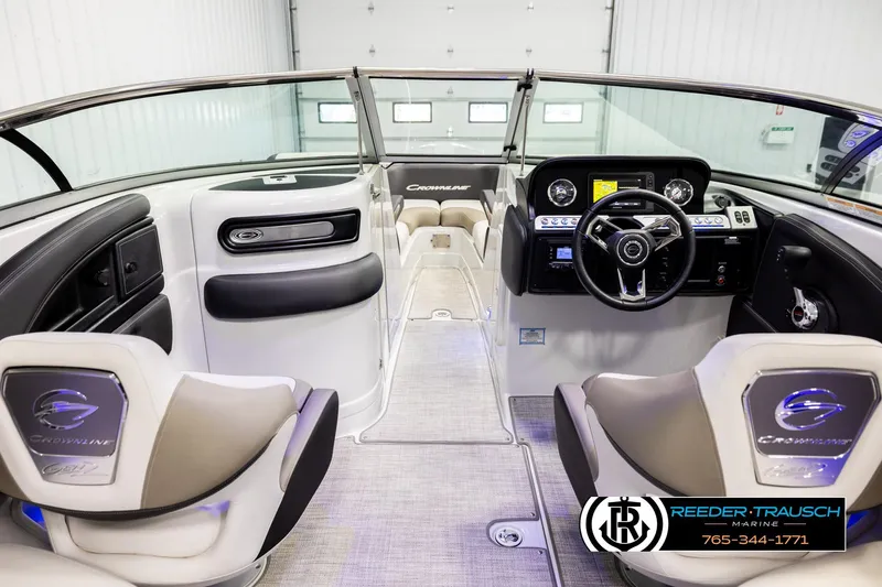 Slide: The Image of 2022 Crownline 265 SS boat interior with modern dashboard and seating. - 15