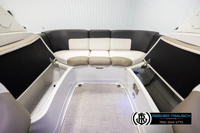 Slide: The Image of 2022 Crownline 265 SS boat interior with spacious seating and storage compartments. - 22
