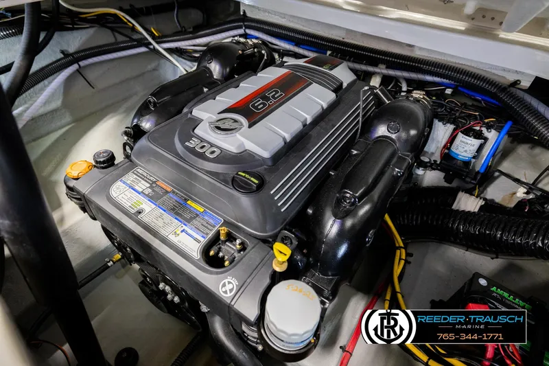 Slide: The Image of Engine of 2022 Crownline 265 SS boat, featuring a 6.2L 300 horsepower motor. - 38