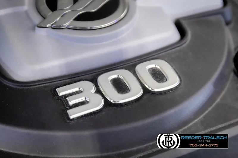 Slide: The Image of 2022 Crownline 265 SS engine detail with "300" emblem, Reeder-Trausch Marine branding. - 39