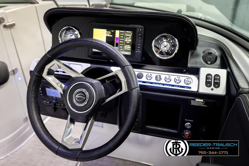 Slide: The Image of 2022 Crownline 265 SS dashboard with steering wheel and control panel. - 42