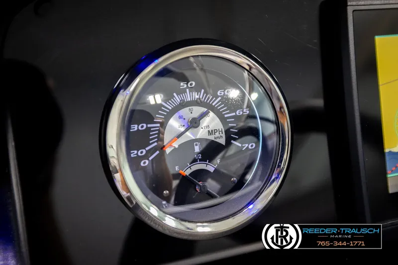 Slide: The Image of Dashboard of 2022 Crownline 265 SS boat showing speedometer and fuel gauge. - 47