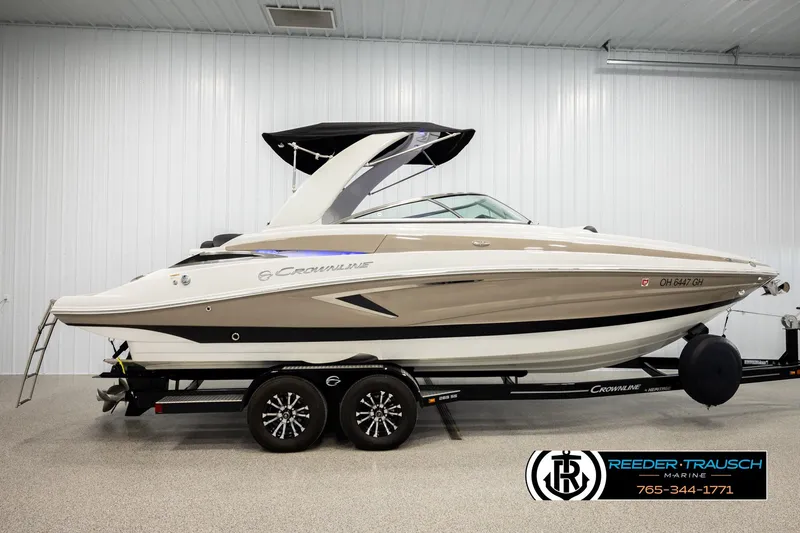 Slide: The Image of 2022 Crownline 265 SS boat on trailer in indoor showroom. - 5