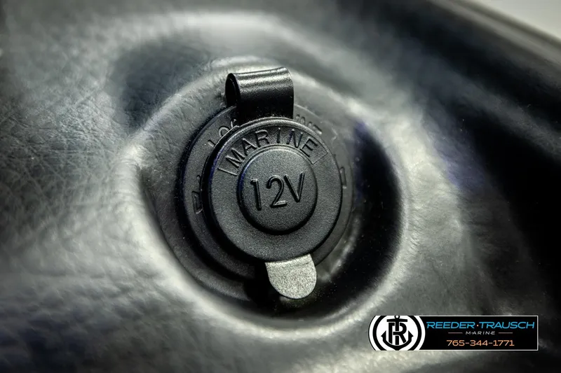 Slide: The Image of 12V marine power outlet on 2022 Crownline 265 SS boat dashboard. - 50