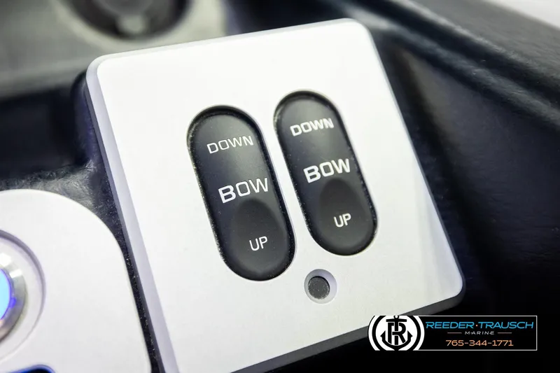 Slide: The Image of Control panel for 2022 Crownline 265 SS boat with bow adjustment buttons. - 51
