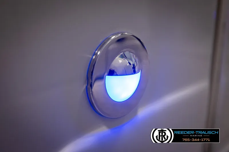 Slide: The Image of Blue LED light on 2022 Crownline 265 SS boat, Reeder-Trausch Marine branding. - 58