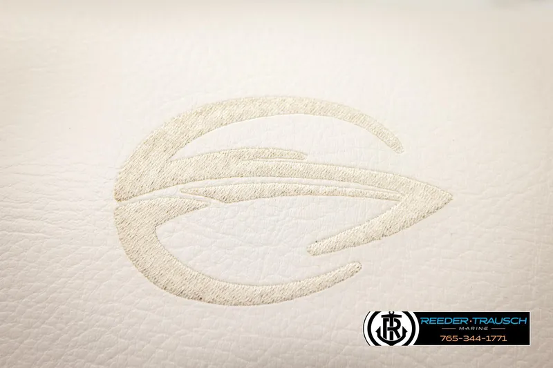 Slide: The Image of Crownline 265 SS 2022 logo on white leather upholstery, Reeder-Trausch Marine branding. - 61