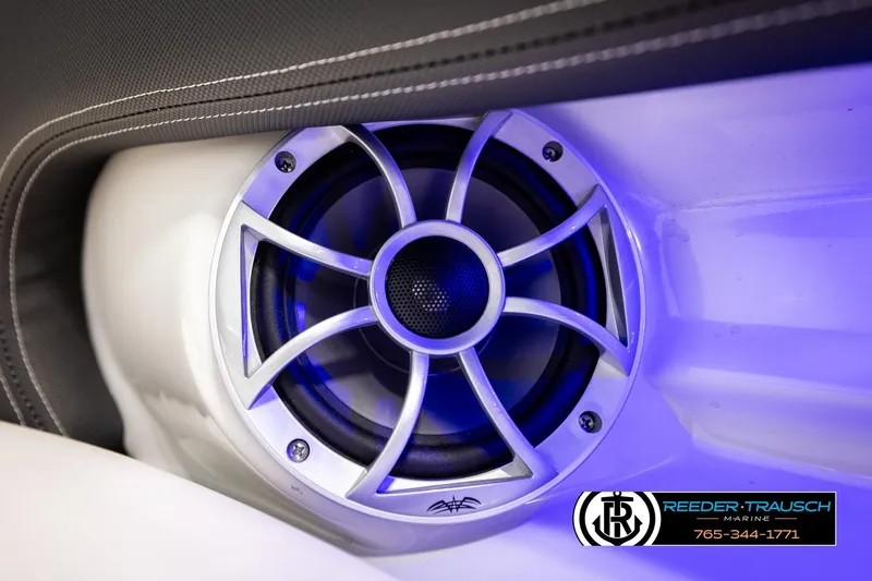 Slide: The Image of Speaker system in 2022 Crownline 265 SS boat with blue LED lighting. - 65
