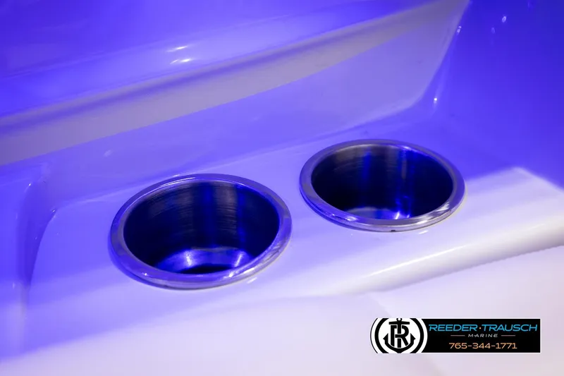 Slide: The Image of Cup holders with blue LED lighting on 2022 Crownline 265 SS boat. - 66
