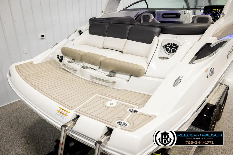 Slide: The Image of 2022 Crownline 265 SS boat with spacious seating and modern design in showroom. - 67