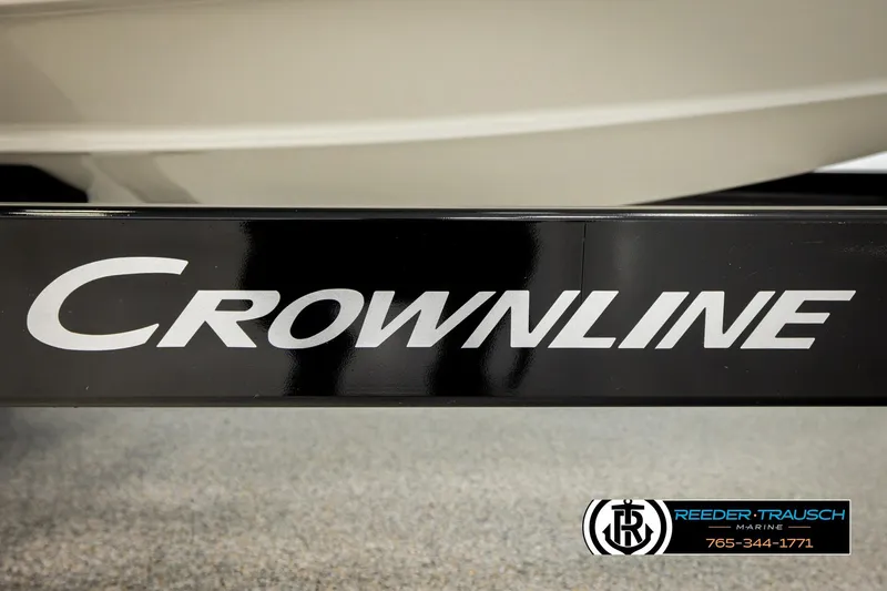 Slide: The Image of 2022 Crownline 265 SS boat trailer with logo, Reeder-Trausch Marine branding. - 74