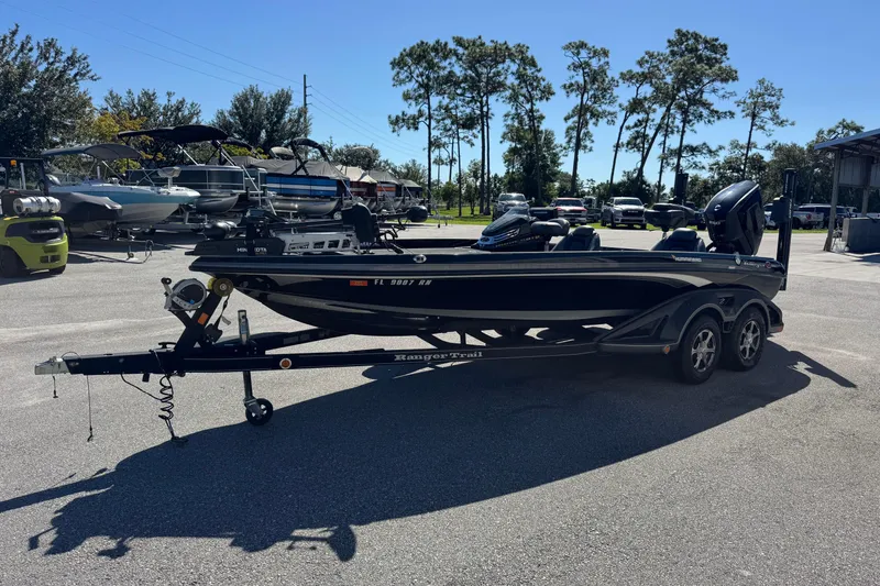 Slide: The Image of 2018 Ranger Z520 Comanche Ranger Cup boat on trailer in parking lot. - 4