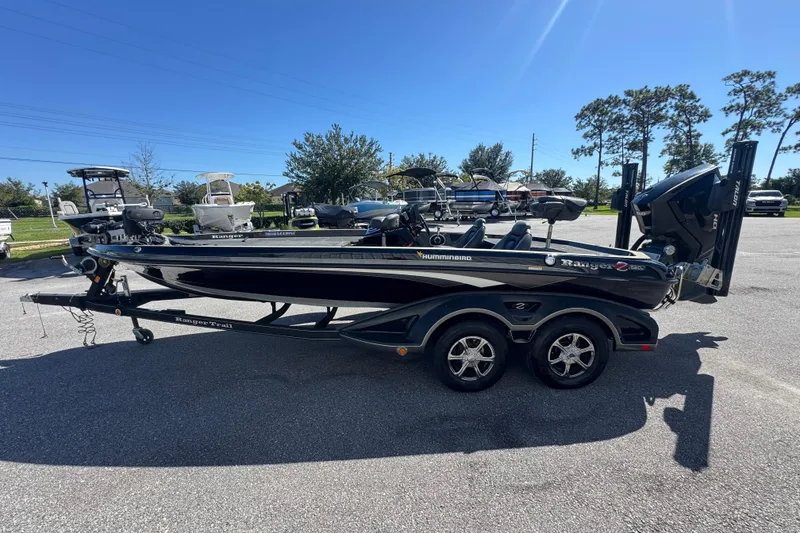 Slide: The Image of 2018 Ranger Z520 Comanche Ranger Cup boat on trailer in parking lot, sunny day. - 5