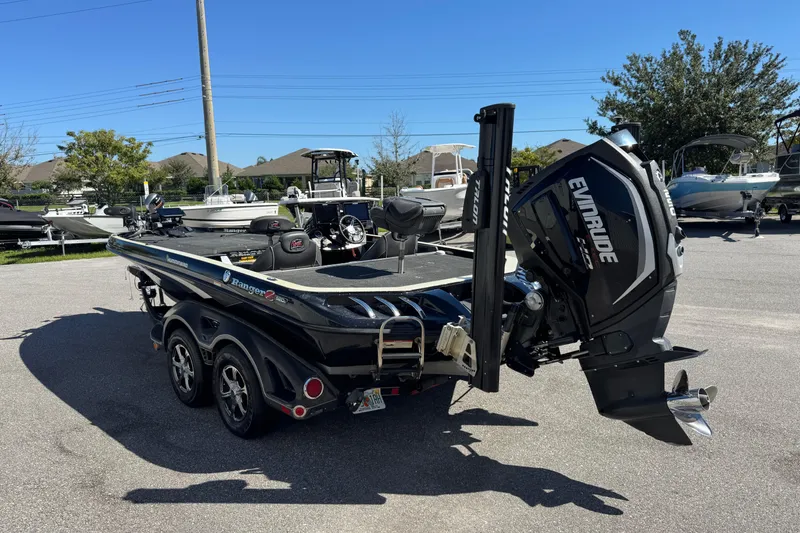 Slide: The Image of 2018 Ranger Z520 Comanche Ranger Cup boat with Evinrude motor in a parking lot. - 7