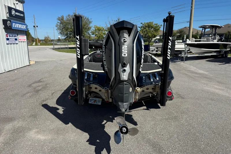 Slide: The Image of 2018 Ranger Z520 Comanche Ranger Cup boat with Evinrude engine, parked outdoors. - 8