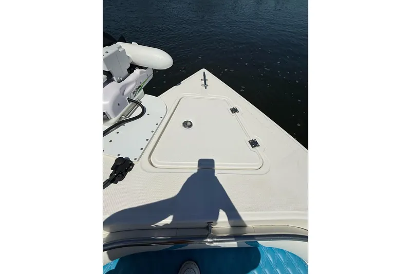 Slide: The Image of Bow of 2021 Custom Infusion 34 CC boat with hatch and water view. - 10