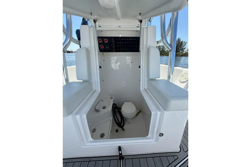 Slide: The Image of 2021 Custom Infusion 34 CC boat interior with seating and control panel. - 12