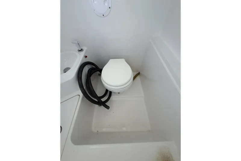 Slide: The Image of Boat bathroom with toilet and hose, Custom Infusion 34 CC, 2021 model. - 13