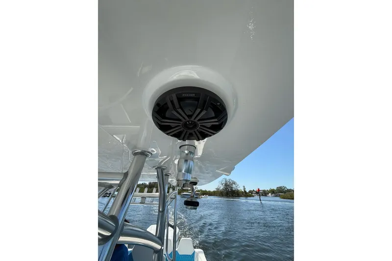 Slide: The Image of Custom Infusion 34 CC 2021 boat with speaker system, cruising on a sunny day. - 17