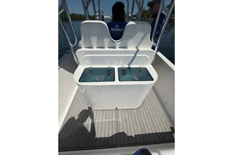 Slide: The Image of 2021 Custom Infusion 34 CC boat interior with dual livewells on deck. - 23