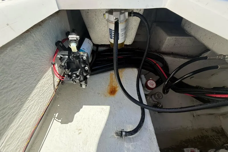 Slide: The Image of 2021 Custom Infusion 34 CC boat engine compartment with fuel filter and wiring. - 29