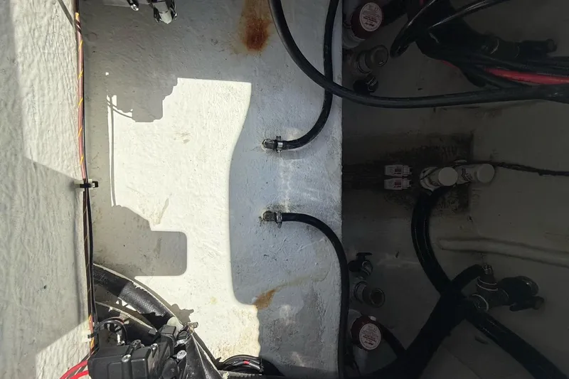 Slide: The Image of Interior view of 2021 Custom Infusion 34 CC boat showing wiring and components. - 31